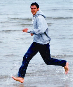 Beach running in wet hoodie